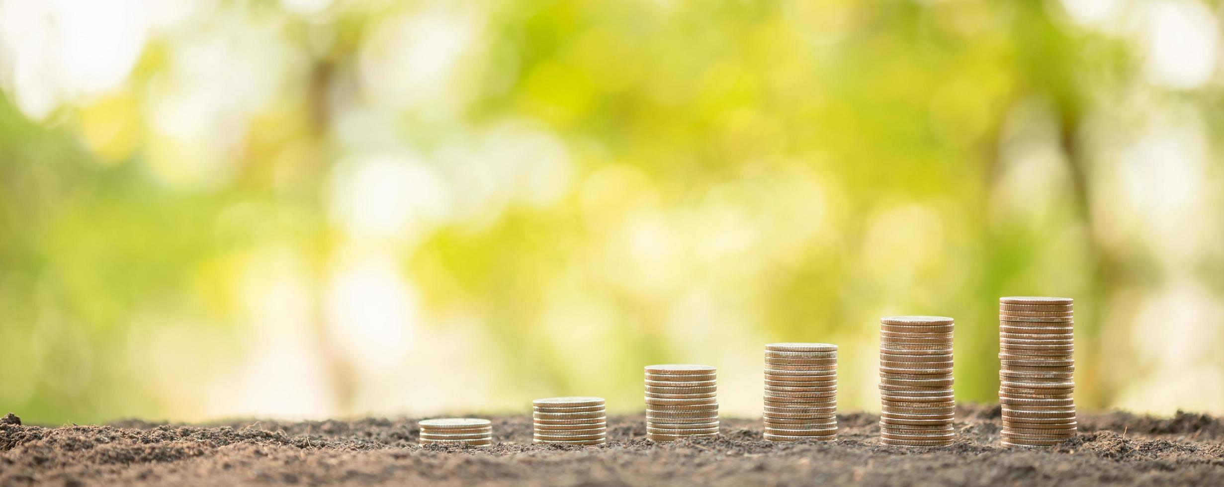 Coin stack on blur background. Business success or money growing concept photo