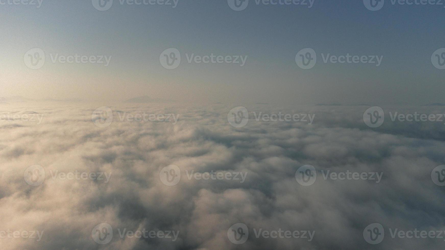 Sea of Fog covers the area on the top of hill Doi Phu Thok, Chiang Khan, Loei, Thailand with background of sunrise on winter. photo