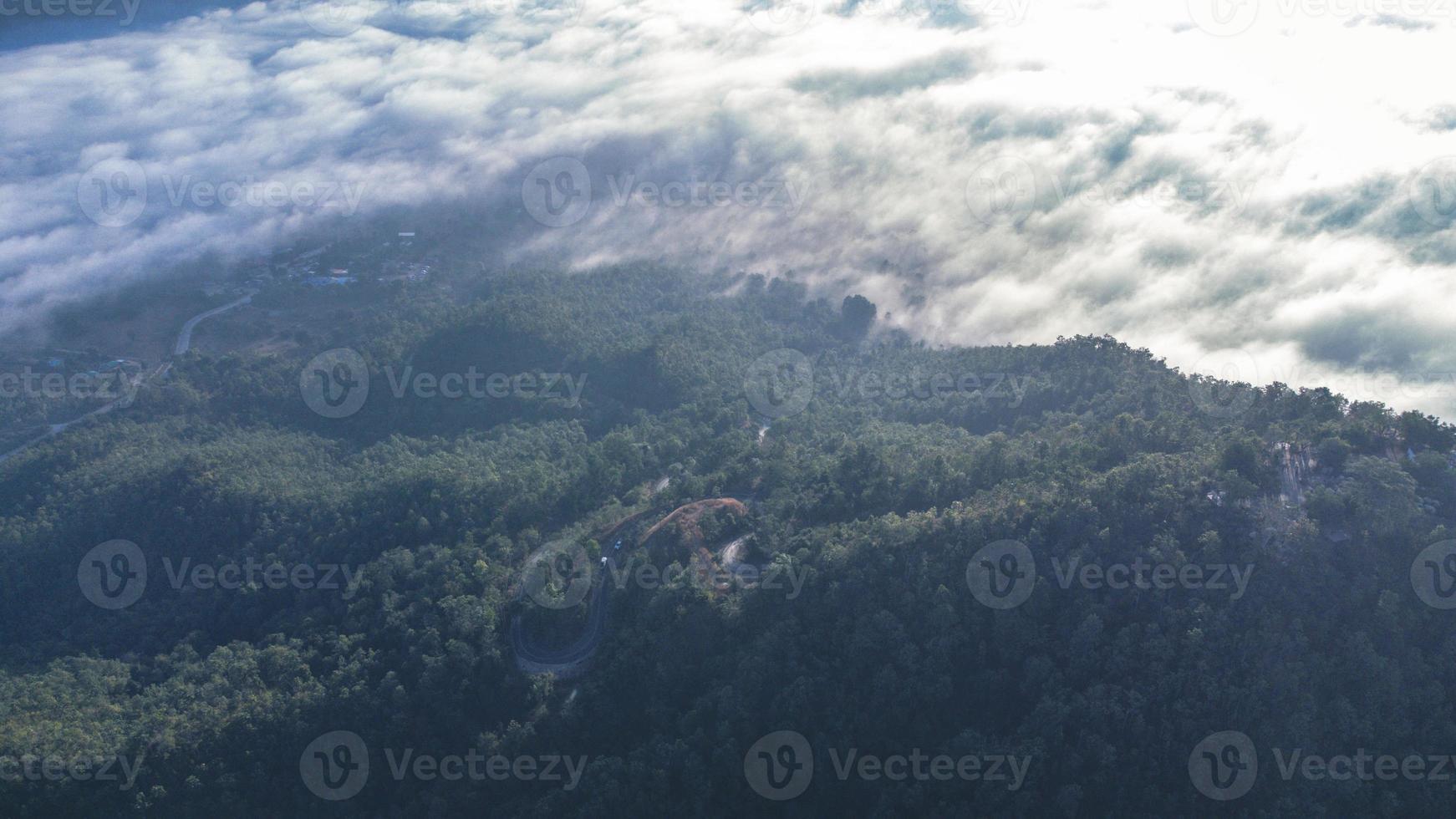 Sea of Fog covers the area on the top of hill Doi Phu Thok, Chiang Khan, Loei, Thailand with background of sunrise on winter. photo