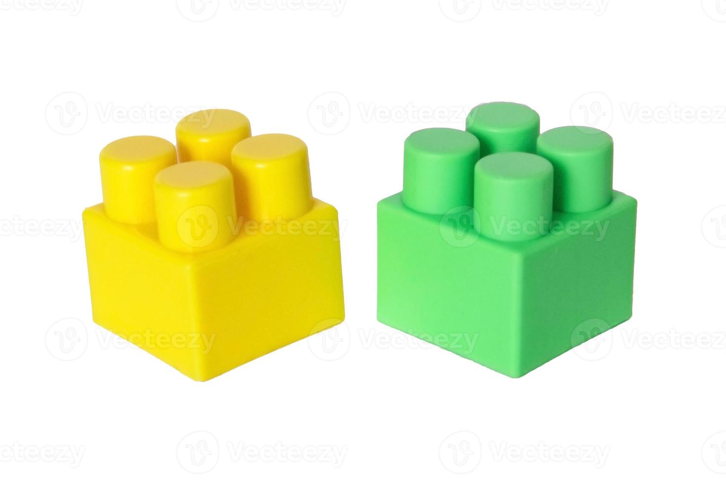 details of a children's plastic constructor on a white background. colored cubes. block. photo