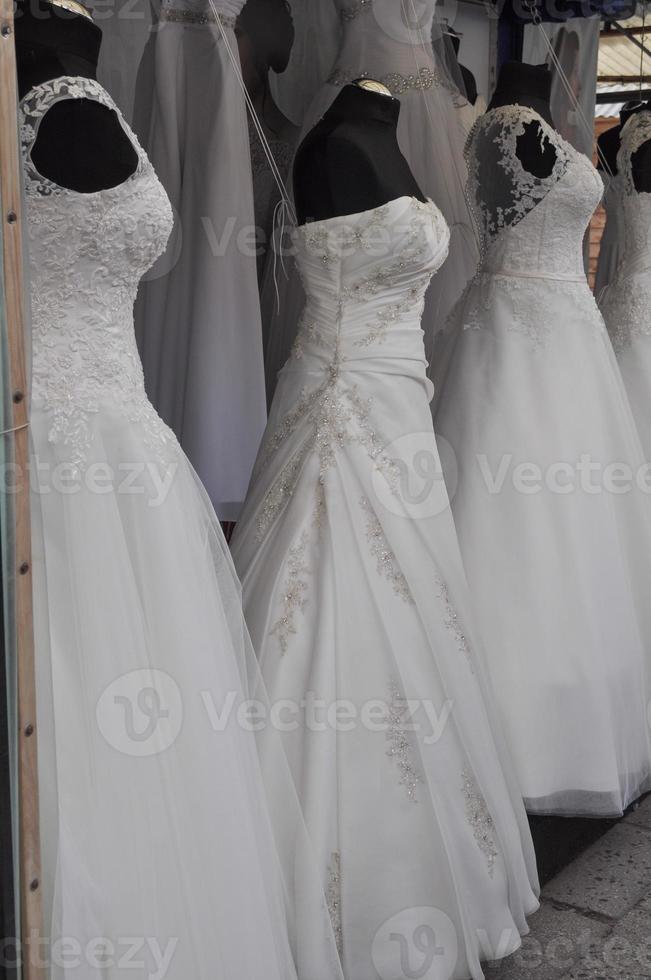 Womens white wedding dresses in a shop photo