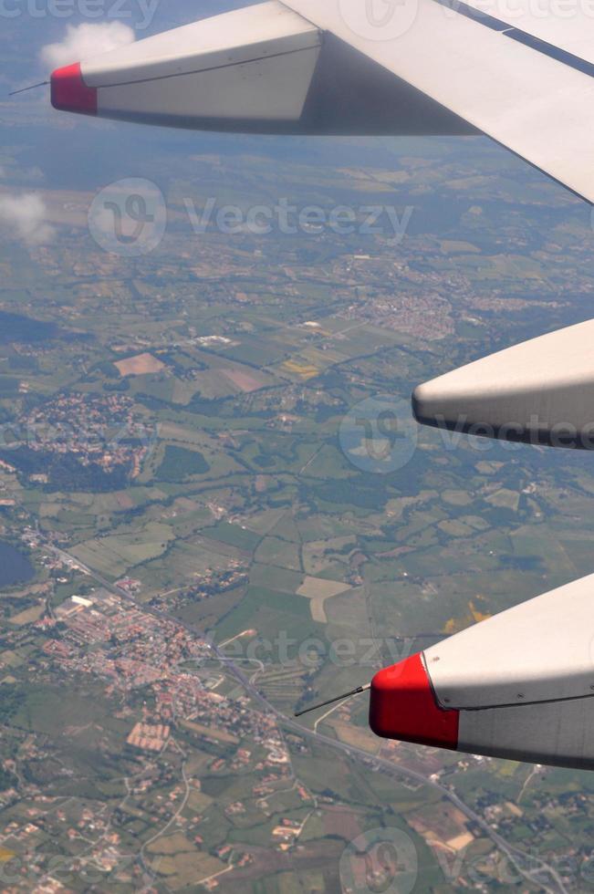 Aerial view from a flying plane in the sky photo