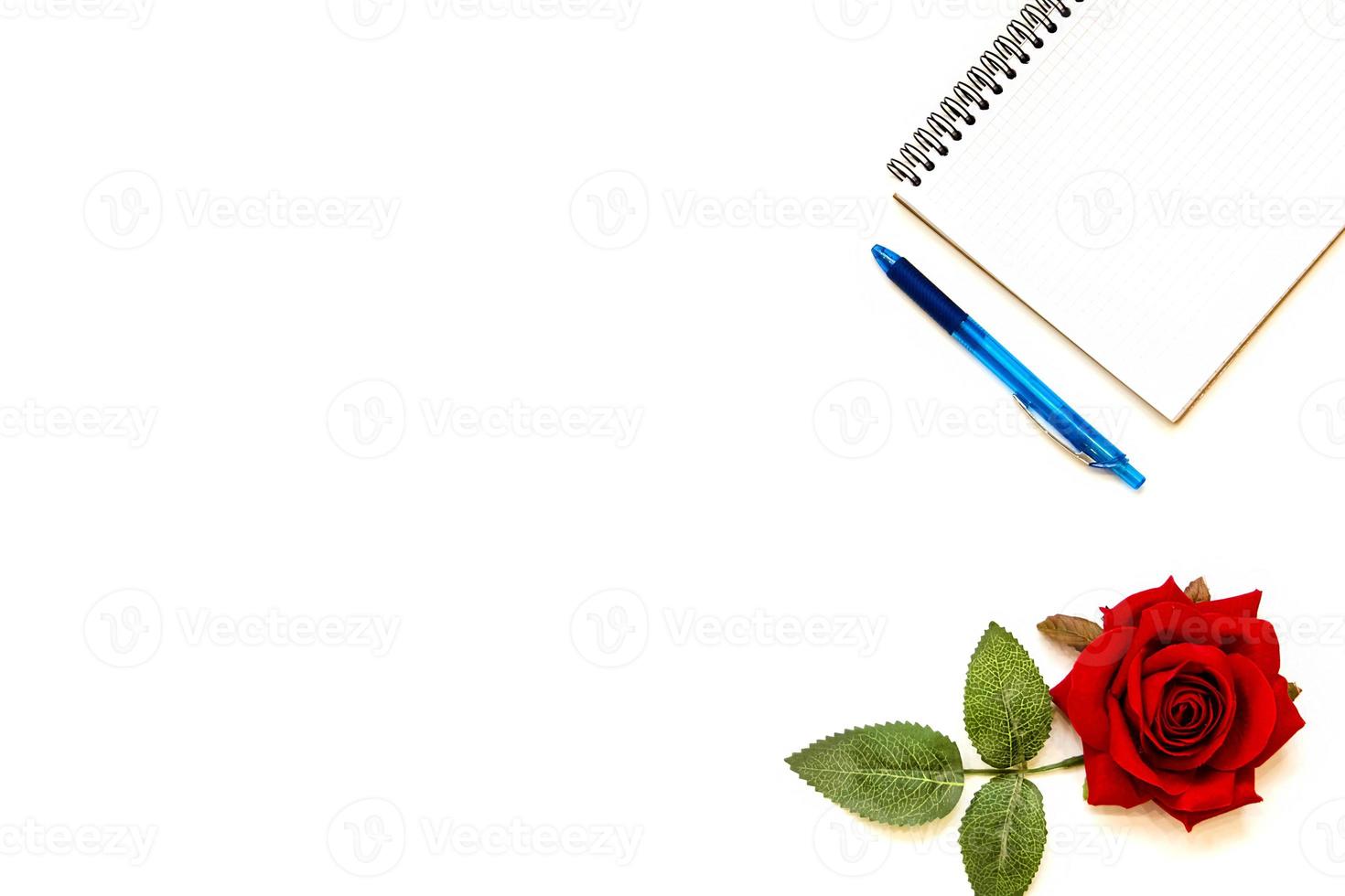 Cup of coffe and open notebook on white background photo
