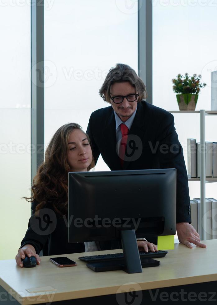 Employee Consulting Middle Age Manager About Work in Office photo