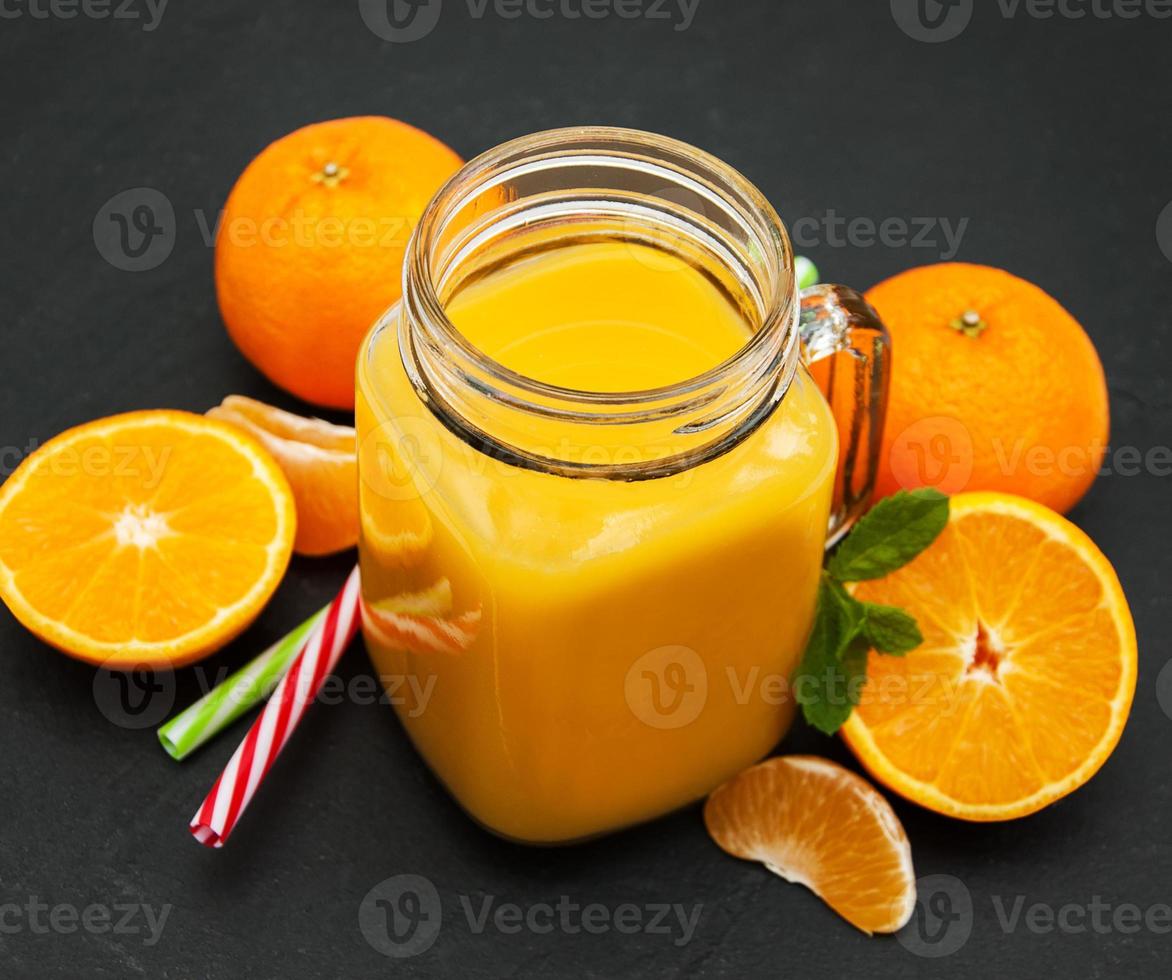 Jar with orange juice photo