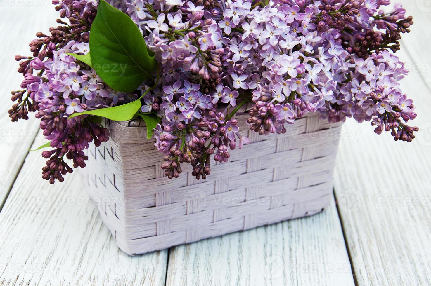 Lilac flowers on table photo