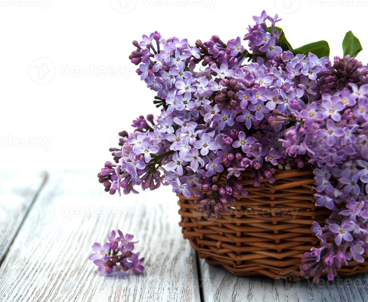 Lilac flowers on table photo