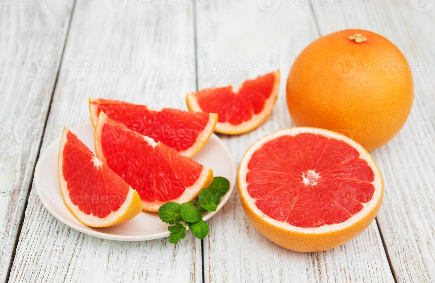 Sliced ripe grapefruits photo