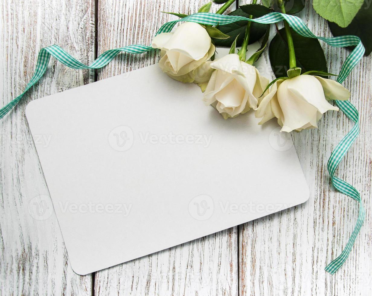 White roses with greeting card photo