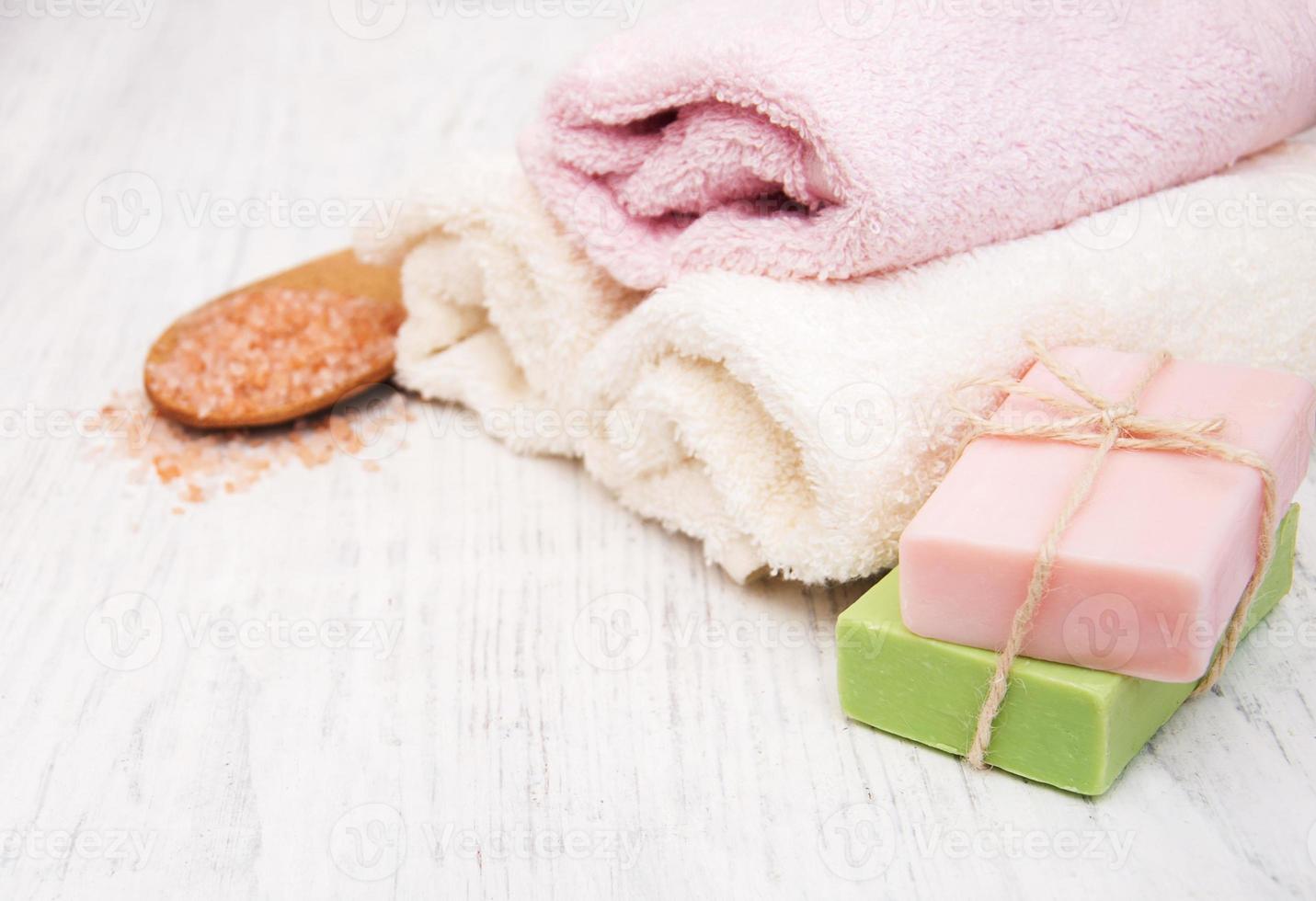 Bath towels, salt and soap photo