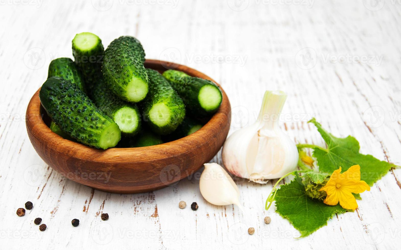 Fresh cucumbers on table photo