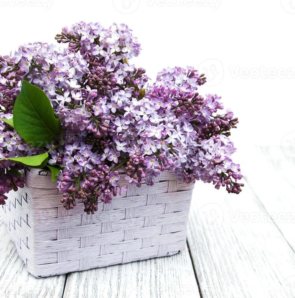 Lilac flowers on table photo