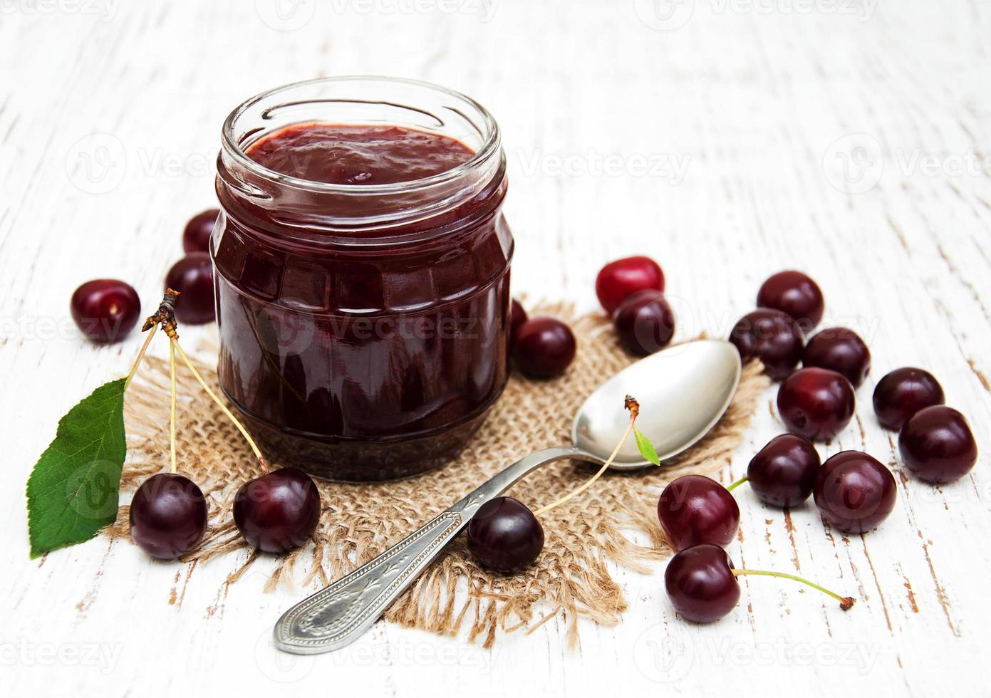Cherry jam with fresh berries photo