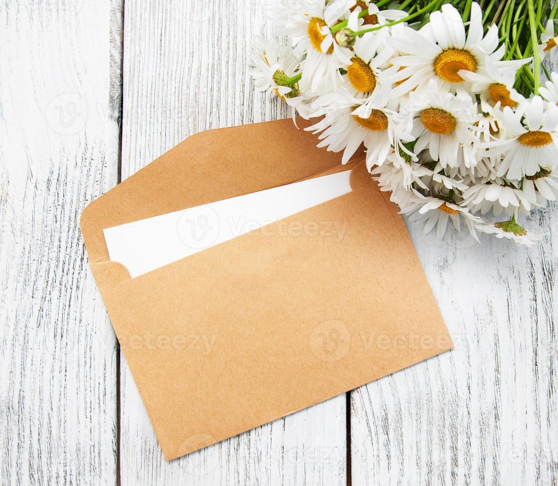 bouquet of daisies with envelope photo