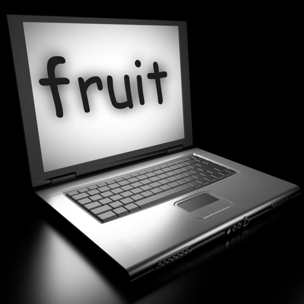 palabra de fruta en la computadora portátil foto