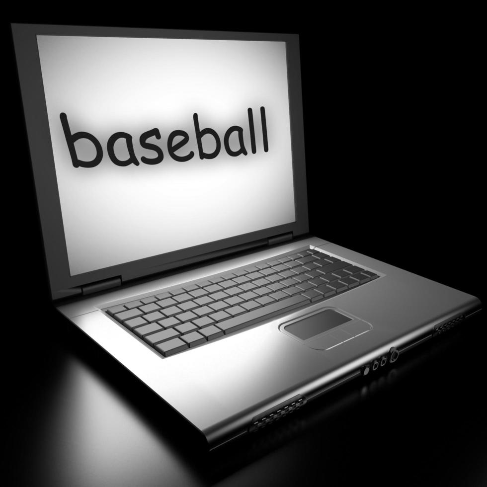 palabra de béisbol en la computadora portátil foto