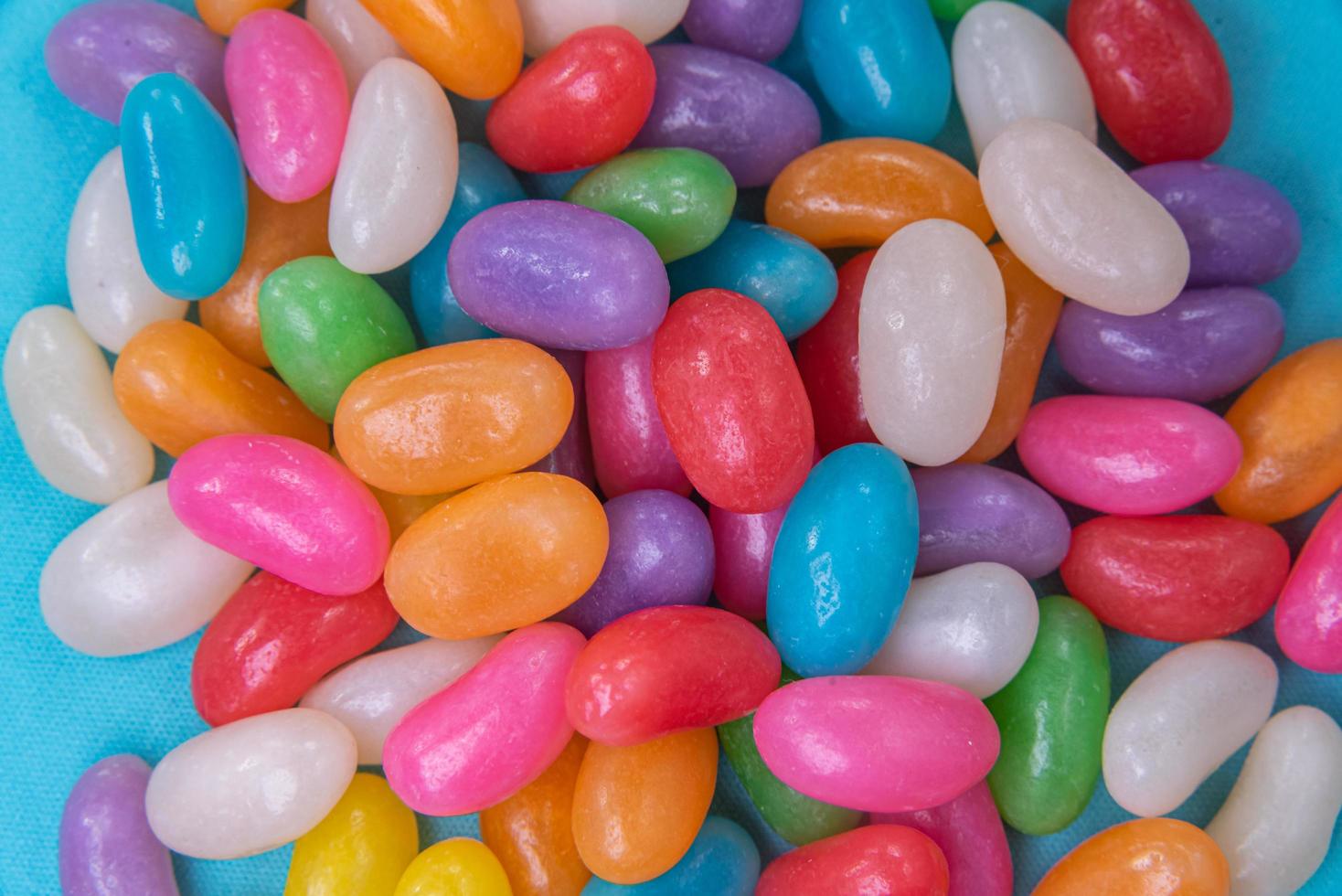 Various jelly beans on the blue background 6053432 Stock Photo at Vecteezy
