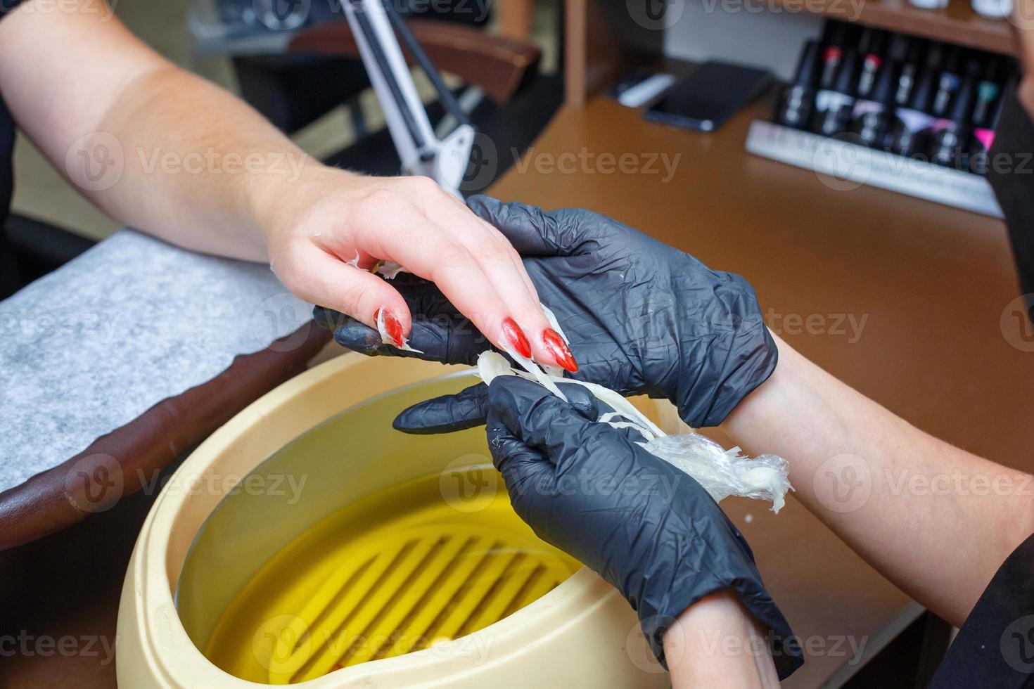 hand care with hot wax, covering with wax, manicure salon photo