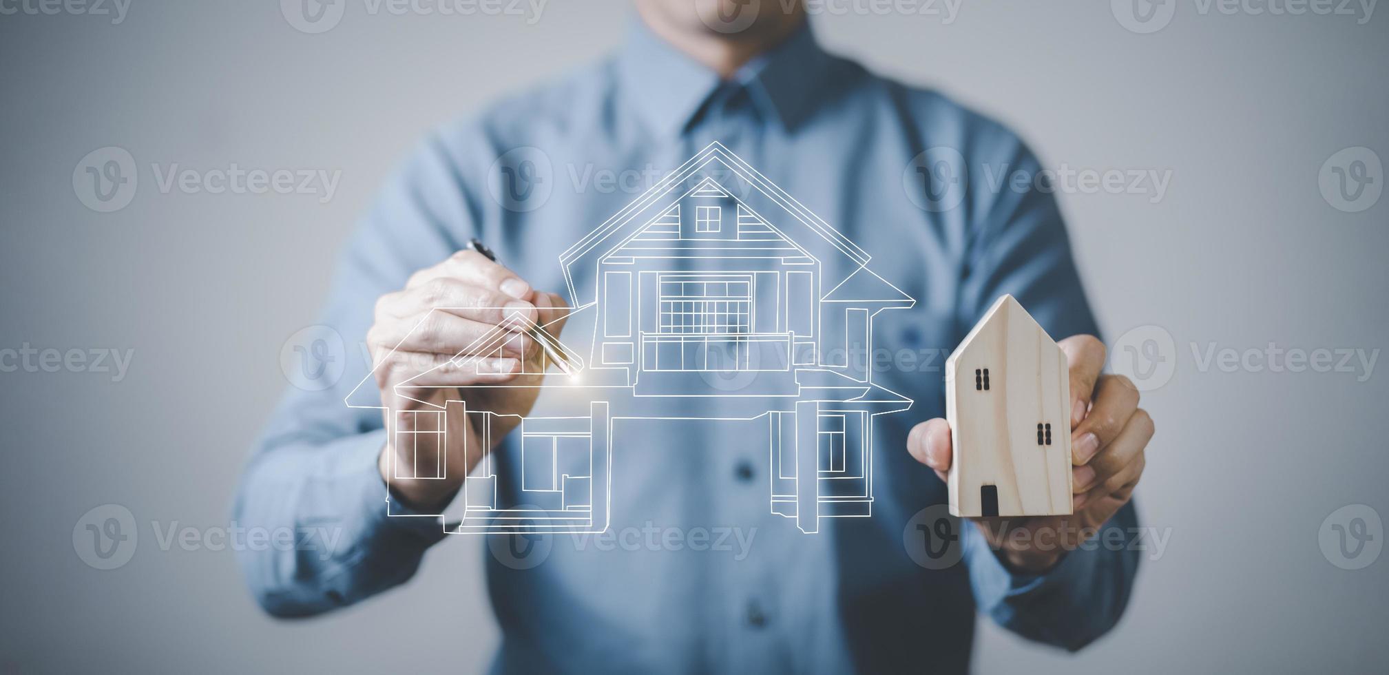 engineering and architecture drawings concept, Engineer man hold house on virtual screen of architect ,Insurance agent with model of house on light background,Property insurance and security concept. photo