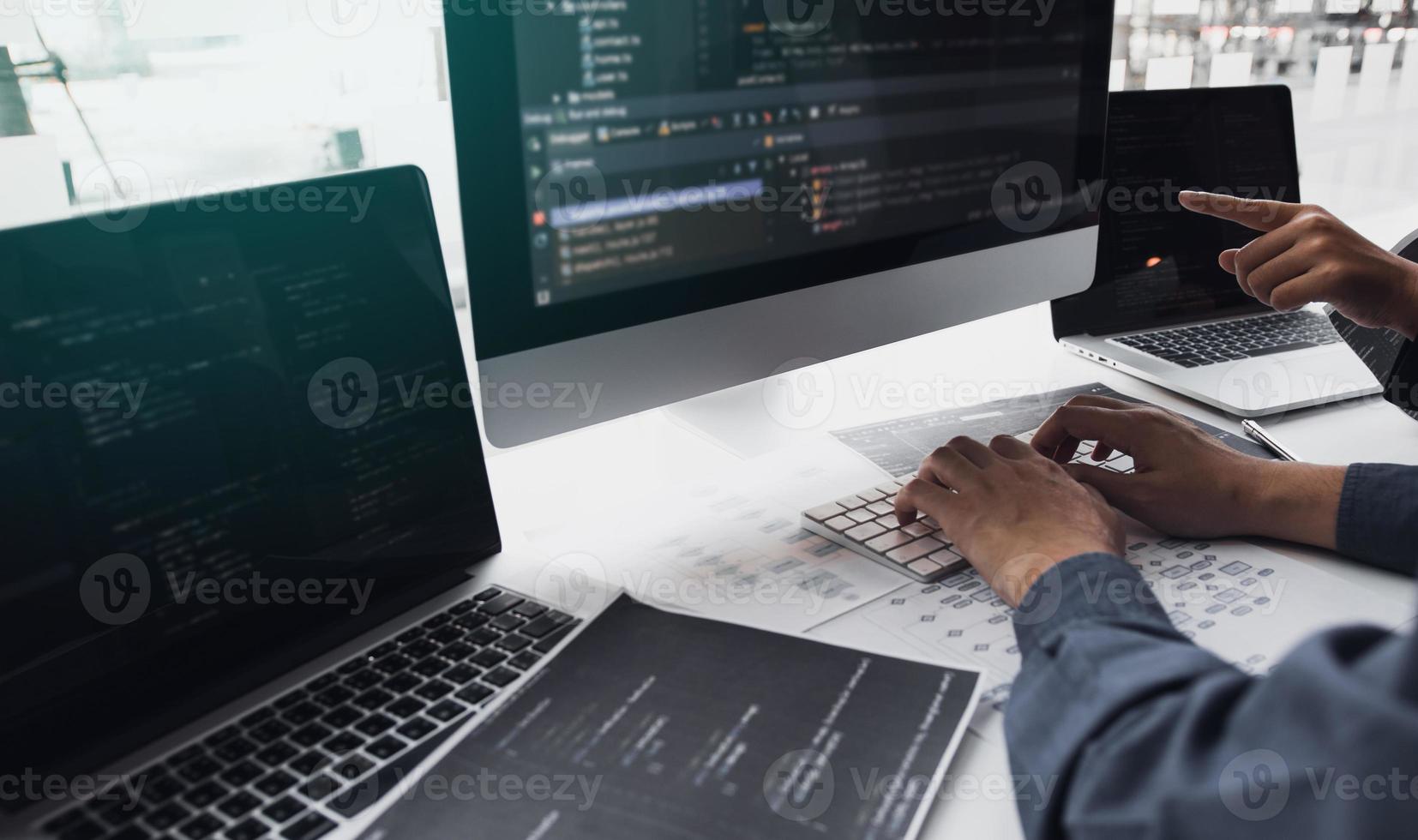 Developing programming and coding technologies working in a software engineers developing applications together in office. photo