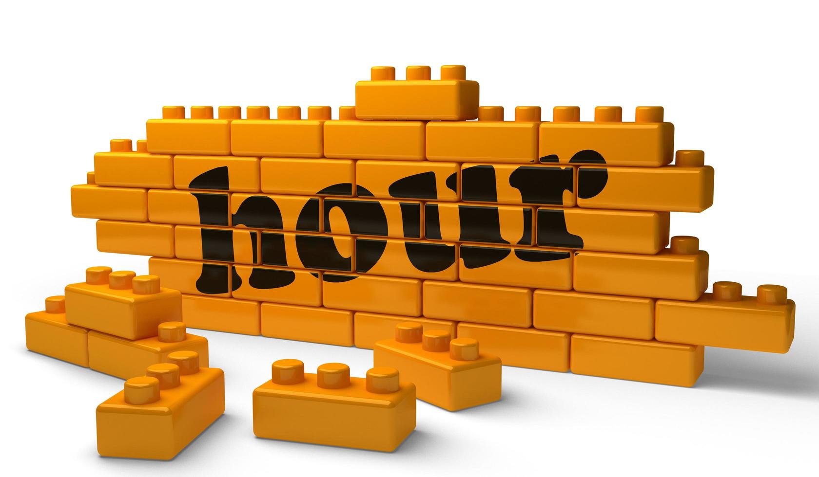 hour word on yellow brick wall photo