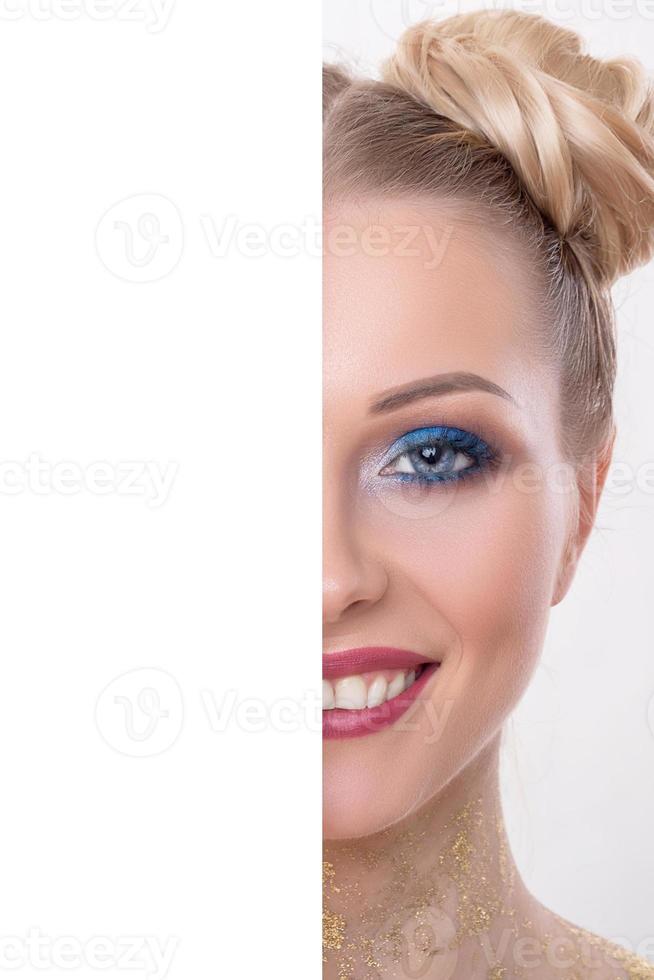 half beauty face with blank board concept, Close up half face portrait of girl with perfect fresh clean skin, young model with beautiful glamorous makeup, copy space, your text here, front view photo