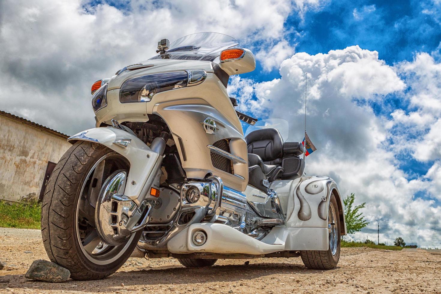 TRIKE Honda GoldWing , motorcycle on three wheels.  against the sky with clouds. Simferopol 4 June 2016 photo