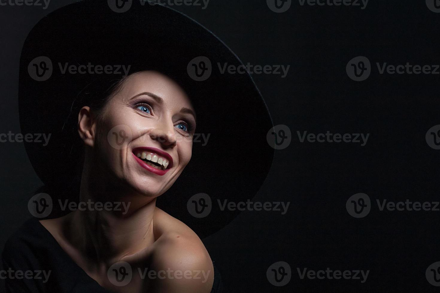 beautiful portrait of a woman in a black hat photo