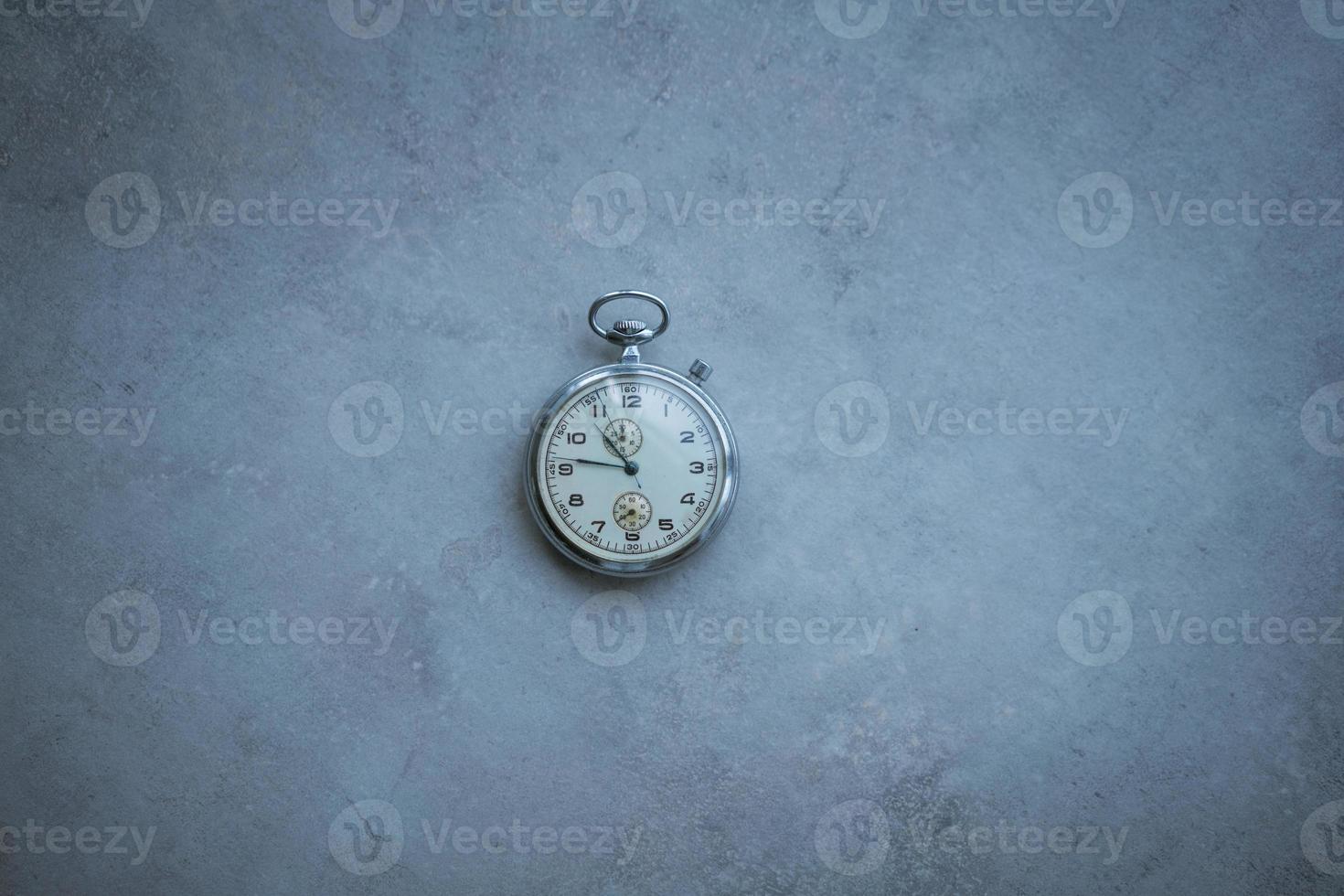 pocket watch on a marble background photo