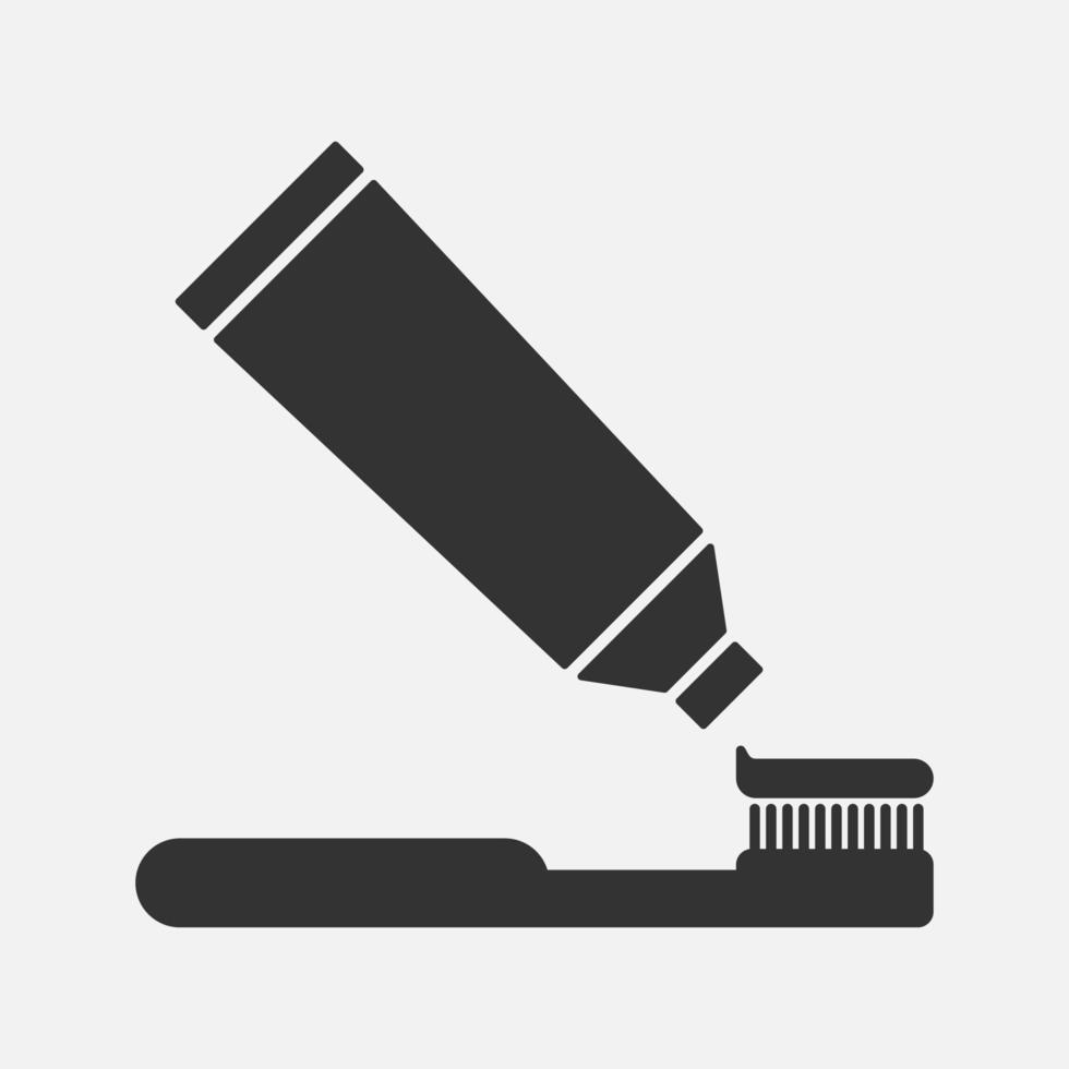 Toothbrush and toothpaste vector icon isolated on white background. Dental hygiene sign