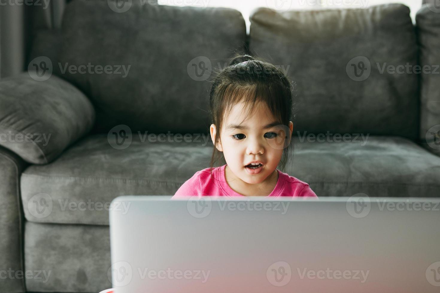 Kindergarten students are learning online with teachers and friends chatting on video on a computer while the school is closed while the virus is spreading. photo