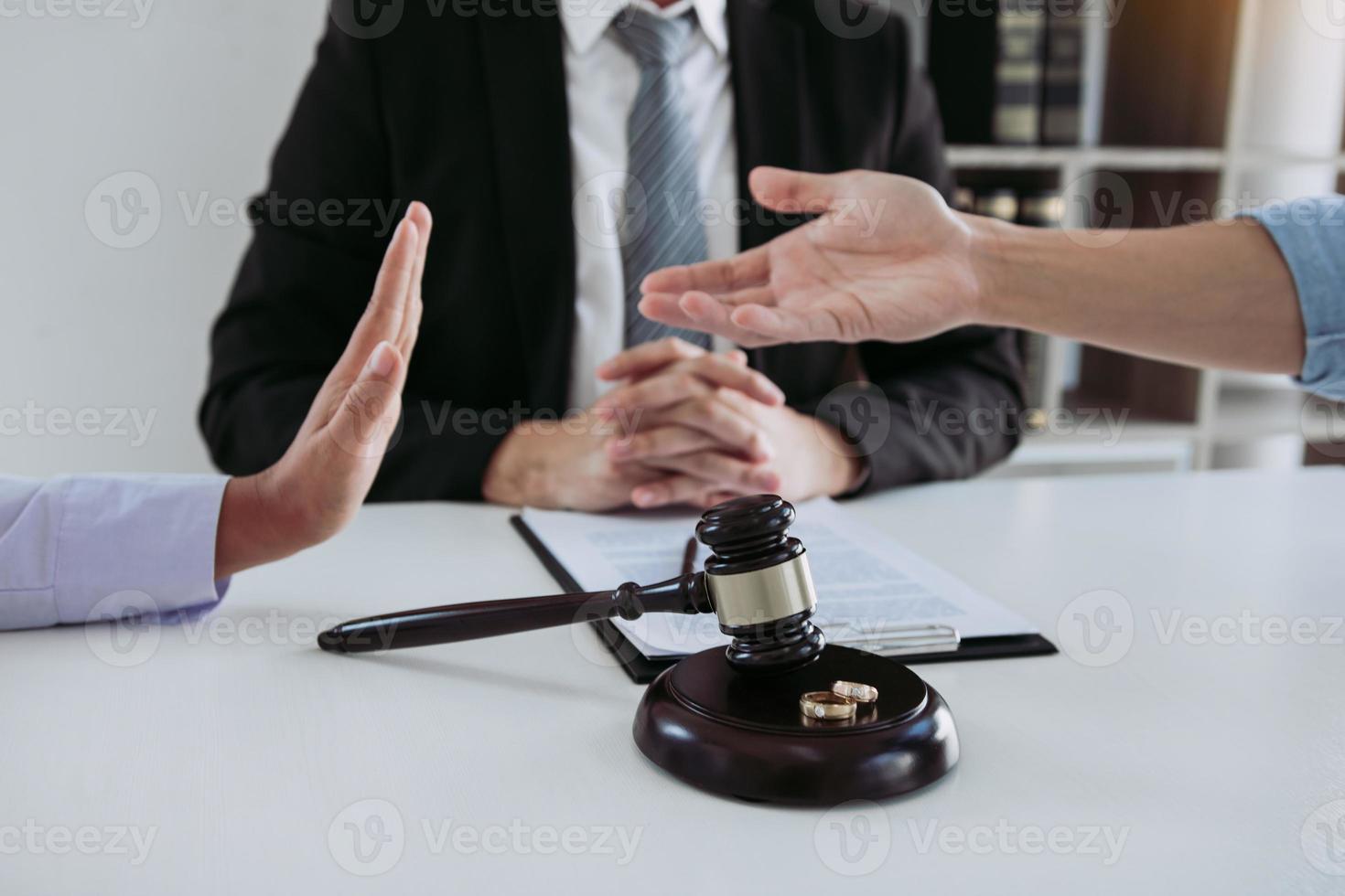 Divorce by two lovers went to the lawyer's office. The husband tried to plead with his wife not to divorce. photo