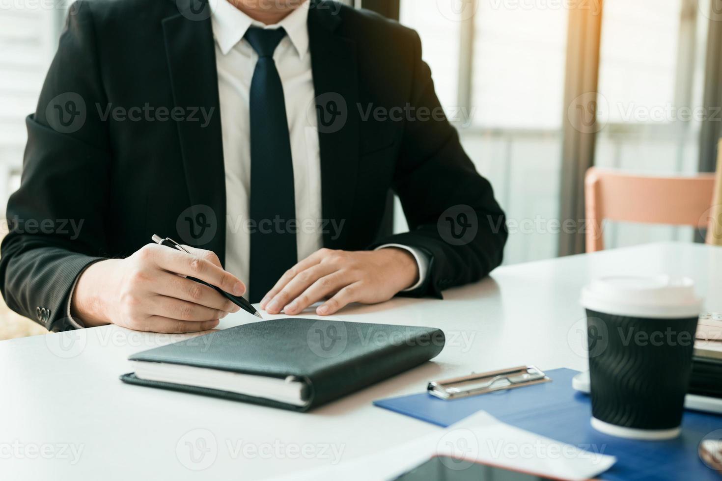 Partner has made a fraud in the contract of sale and being handed a cash and pen to the businessman signing the contract corruption bribery concept. photo