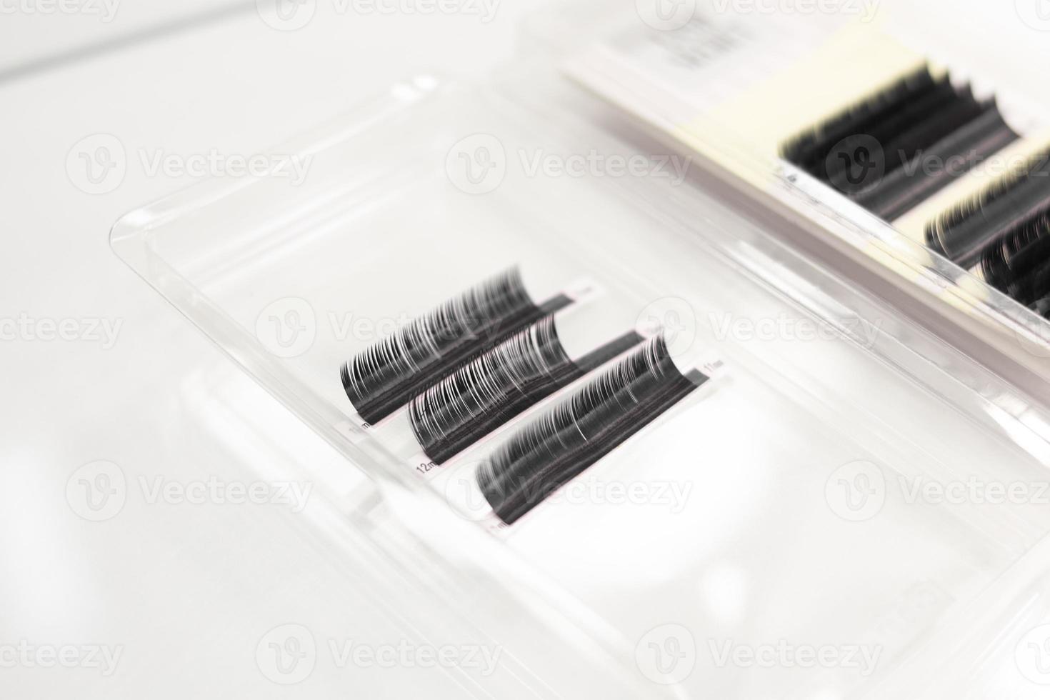 Artificial eyelashes for eyelash extension.  Black eyelash extensions.  Eyelash close-up photo