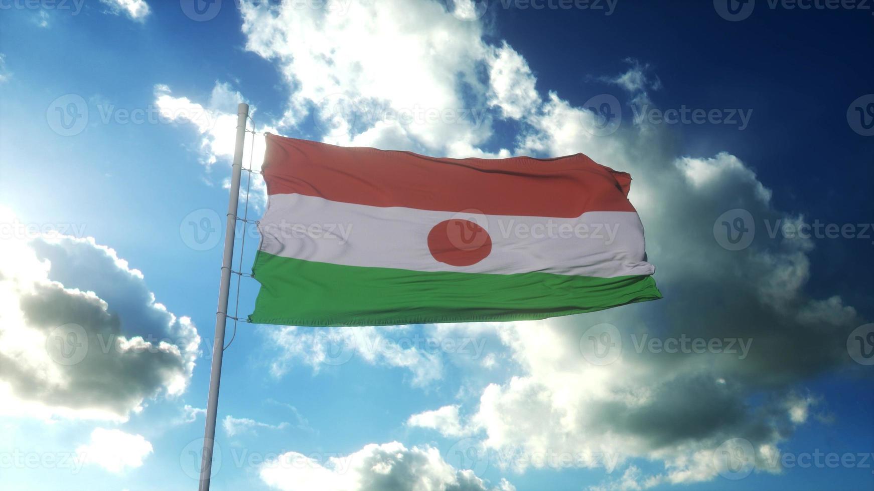 Republic of the Niger flag waving at wind against beautiful blue sky. 3d rendering photo