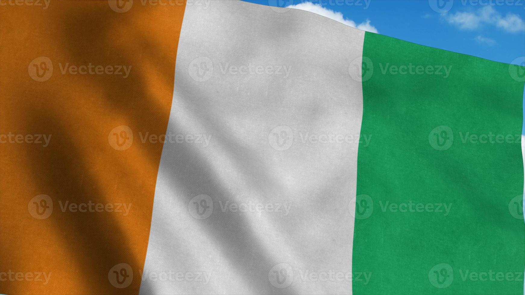 Ivory Coast flag waving in the wind, blue sky background. 3d rendering photo
