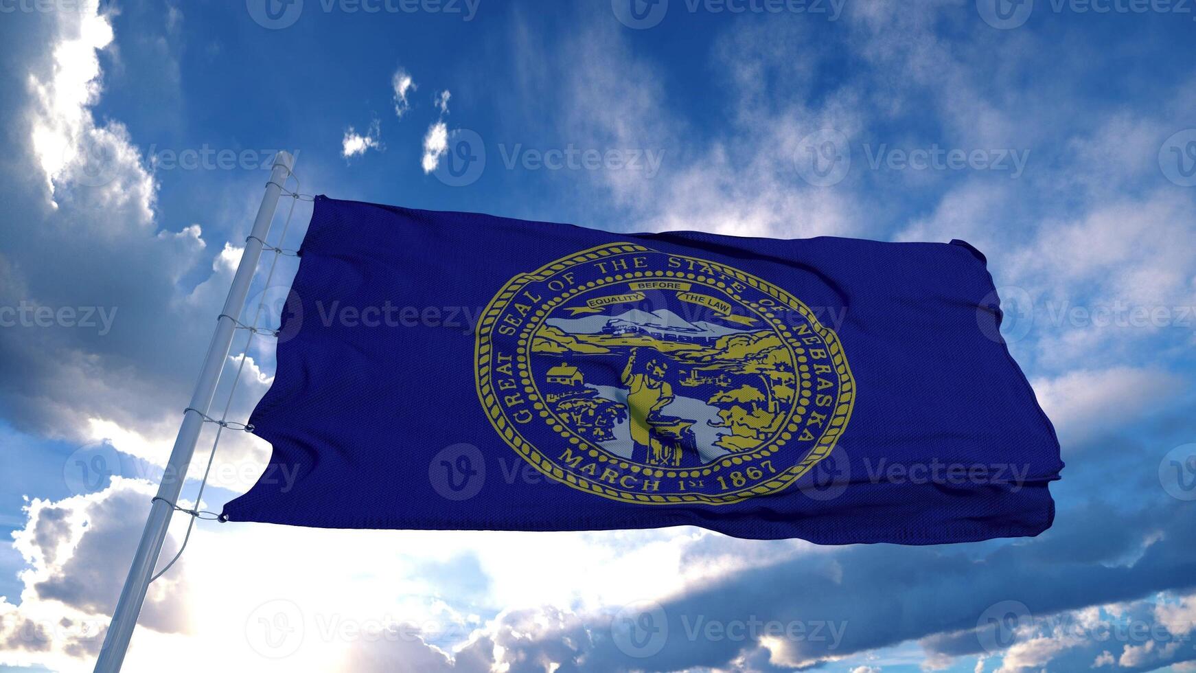 Nebraska flag on a flagpole waving in the wind, blue sky background. 3d rendering photo