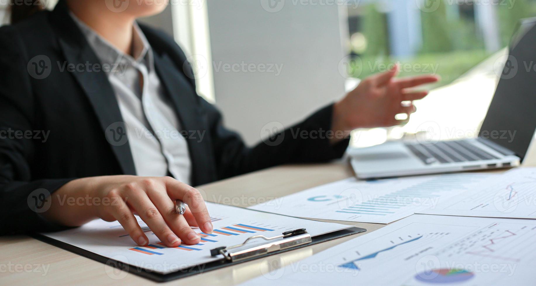 Accounting businessmen are calculating income-expenditure and analyzing real estate investment data, Dedicated to the progress and growth of the company, Financial and tax systems concept. photo