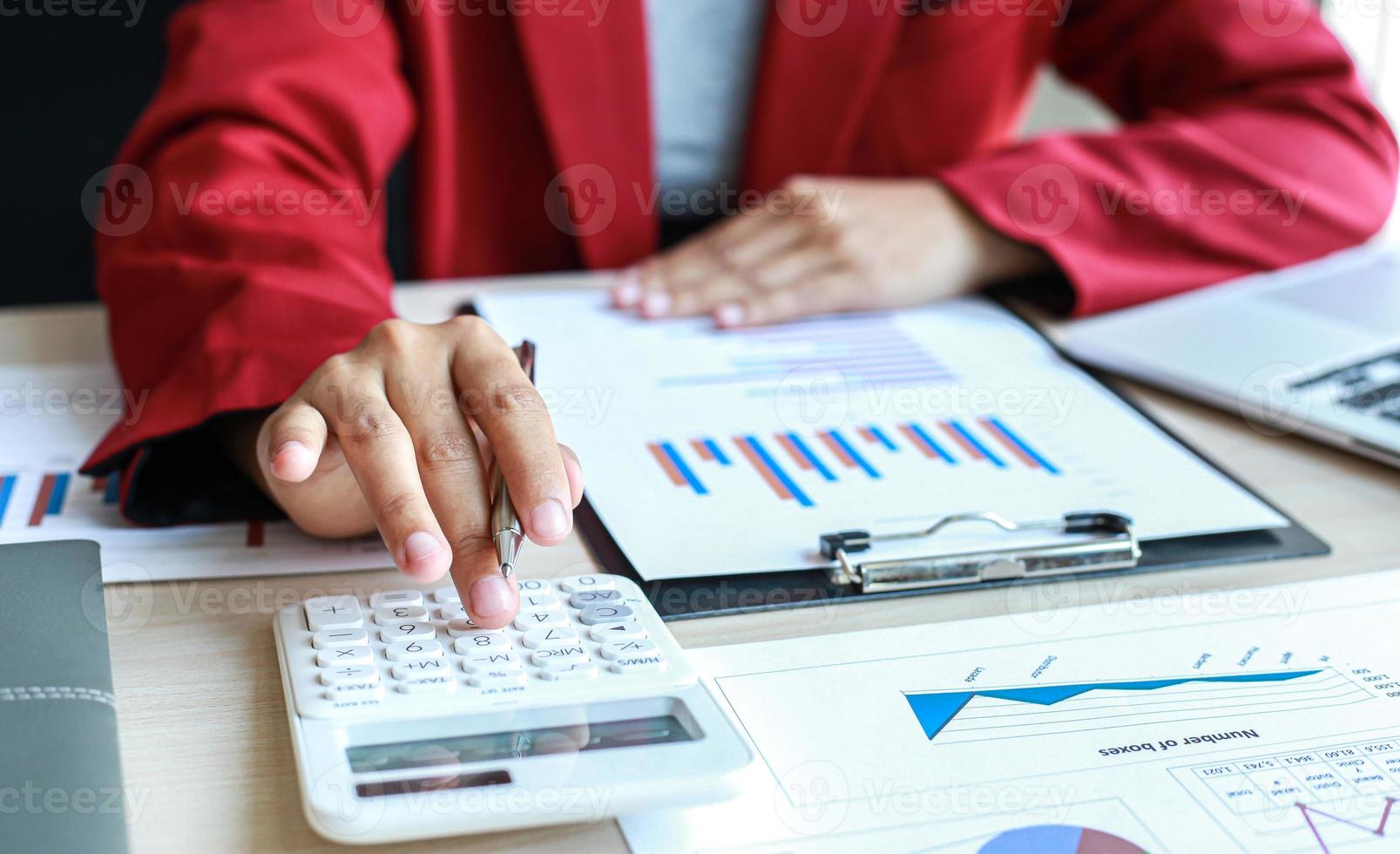 Accounting businessmen are calculating income-expenditure and analyzing real estate investment data, Dedicated to the progress and growth of the company, Financial and tax systems concept. photo