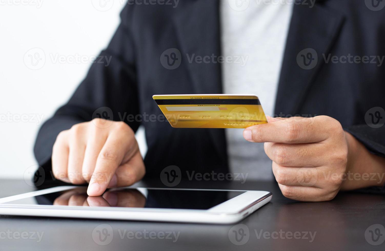 women use laptop to register online purchases using credit card payments, Convenience in the world of technology and the internet, Shopping online and banking online concept. photo