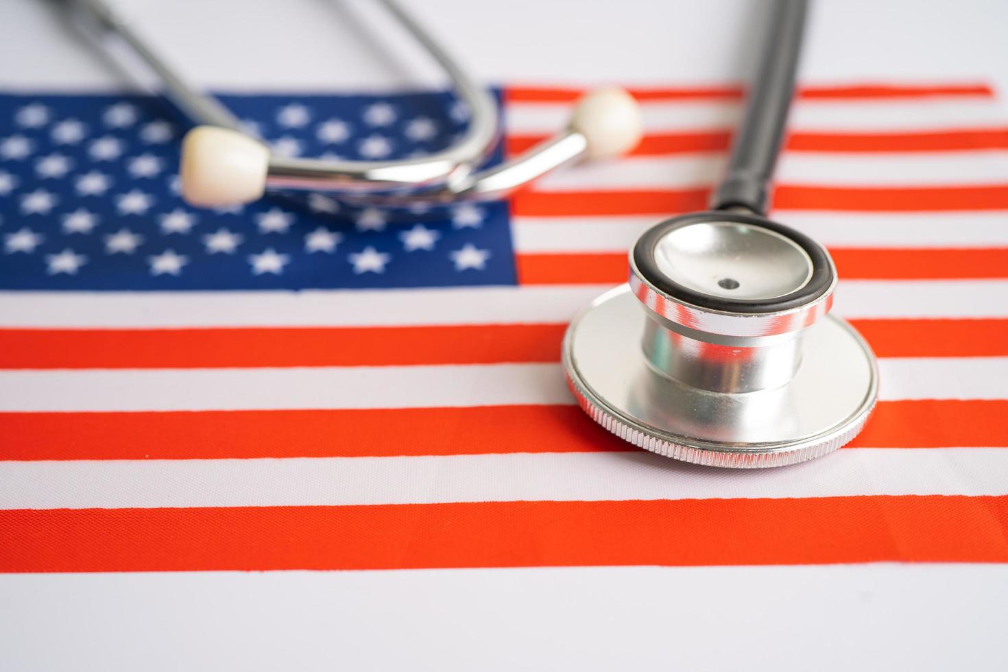 Black stethoscope on USA America flag background, Business and finance concept. photo