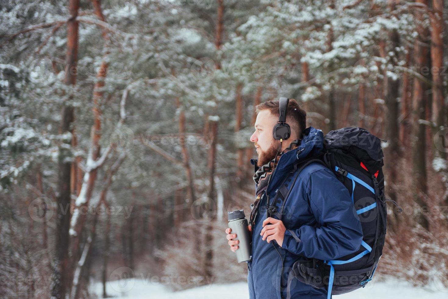 Man Traveler with backpack hiking Travel Lifestyle adventure concept active vacations outdoor. Beautiful landscape  forest photo