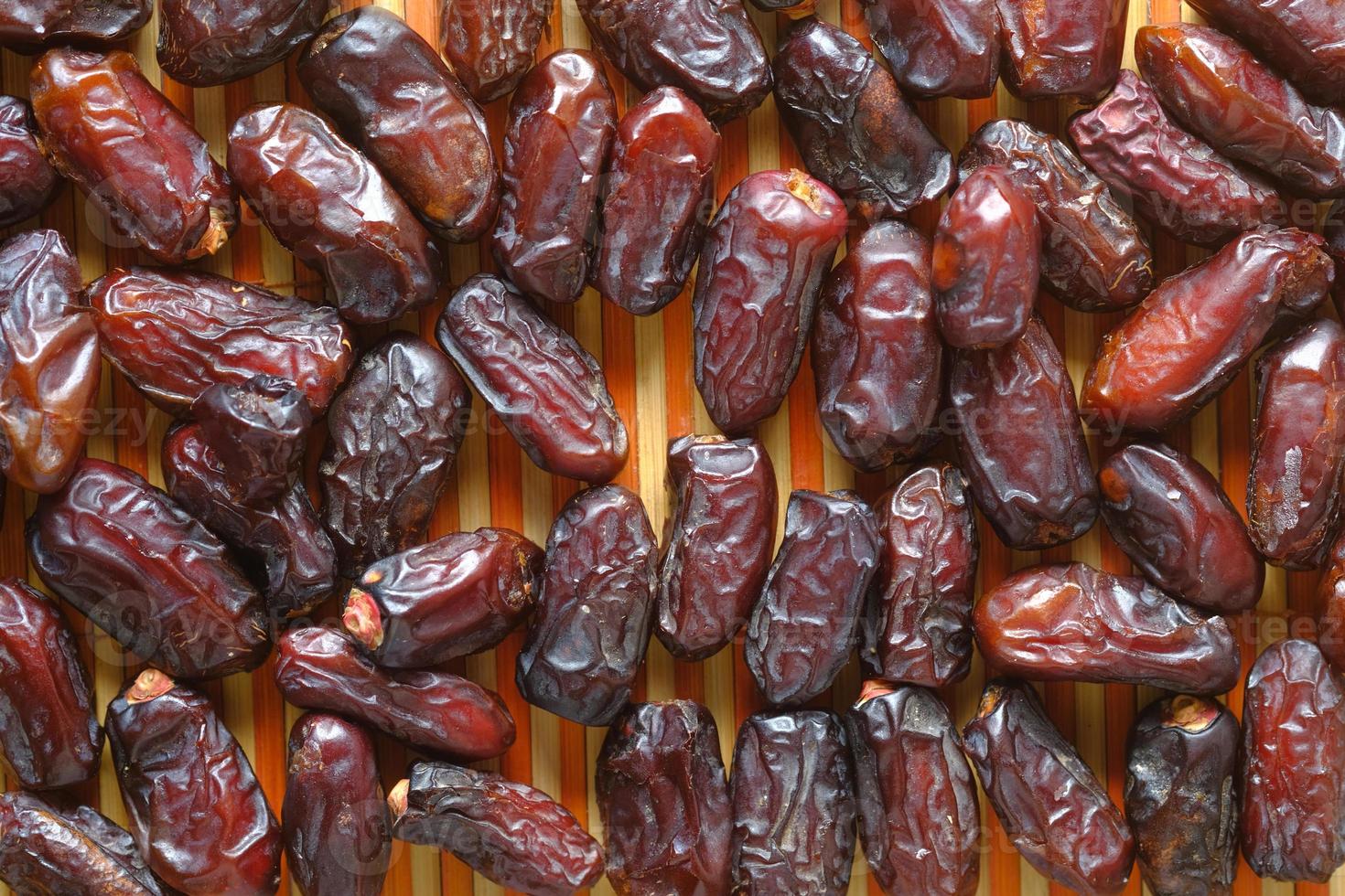close up of fresh date fruits on table photo