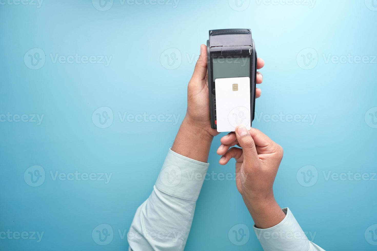 contactless payment concept with young man paying with credit card photo