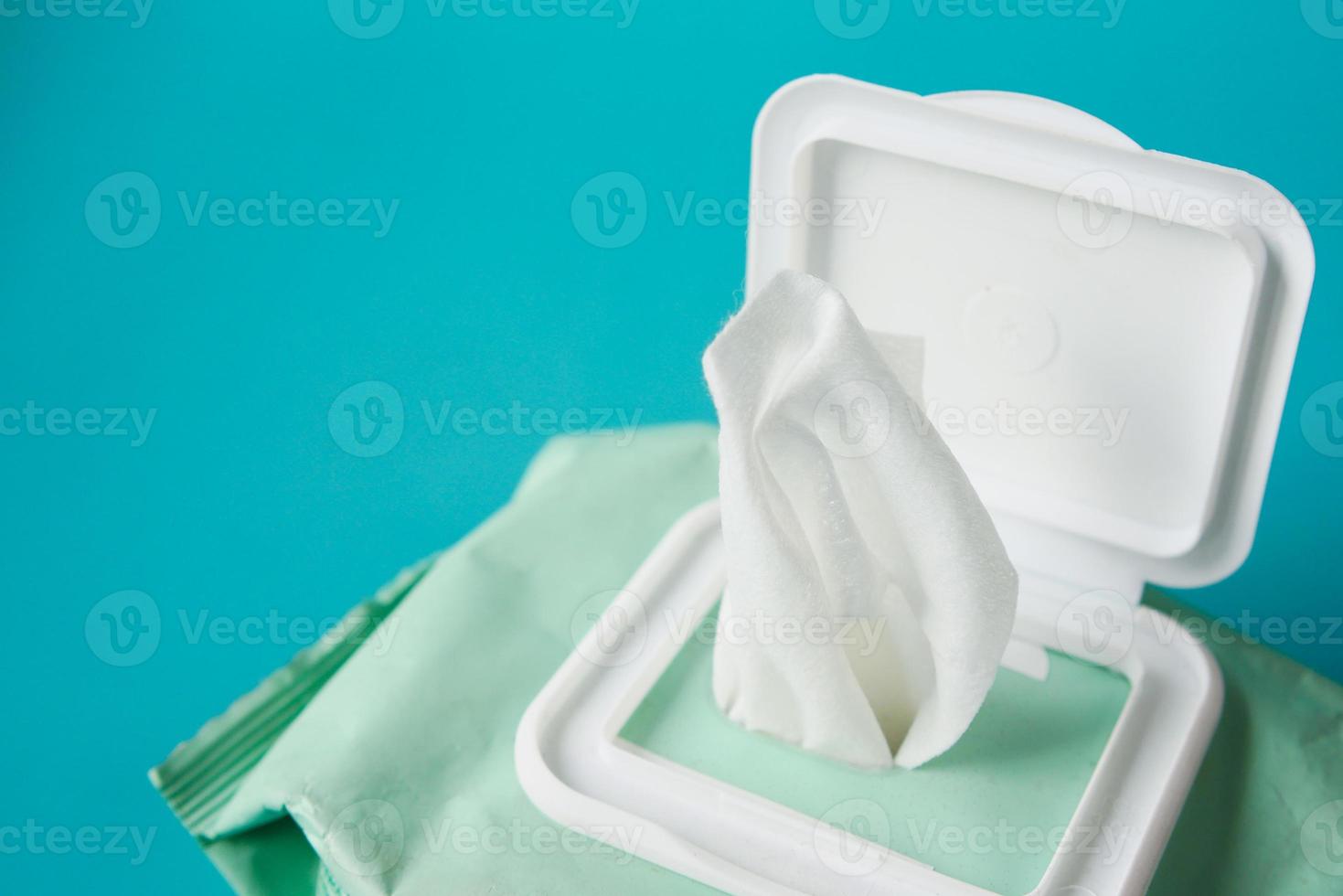 Cleansing wet wipes on table with copy space photo