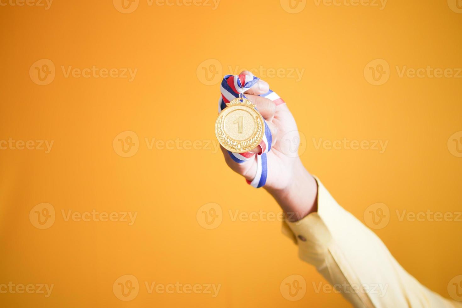 First Place Throphy against yellow background photo