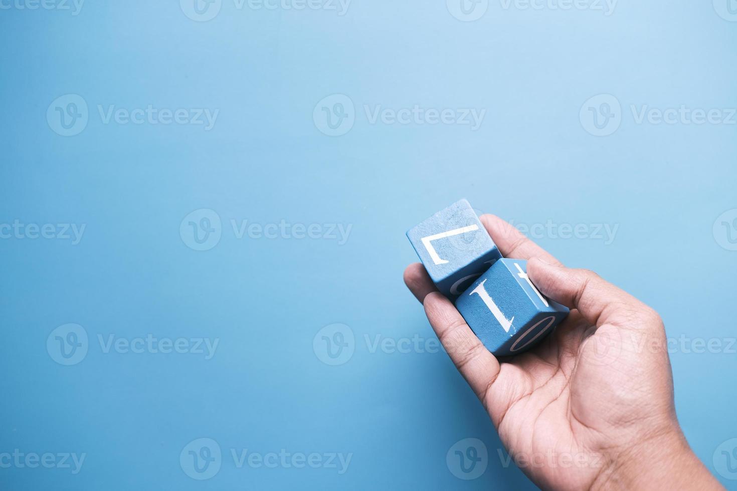 wooden block with numbers on blue background photo
