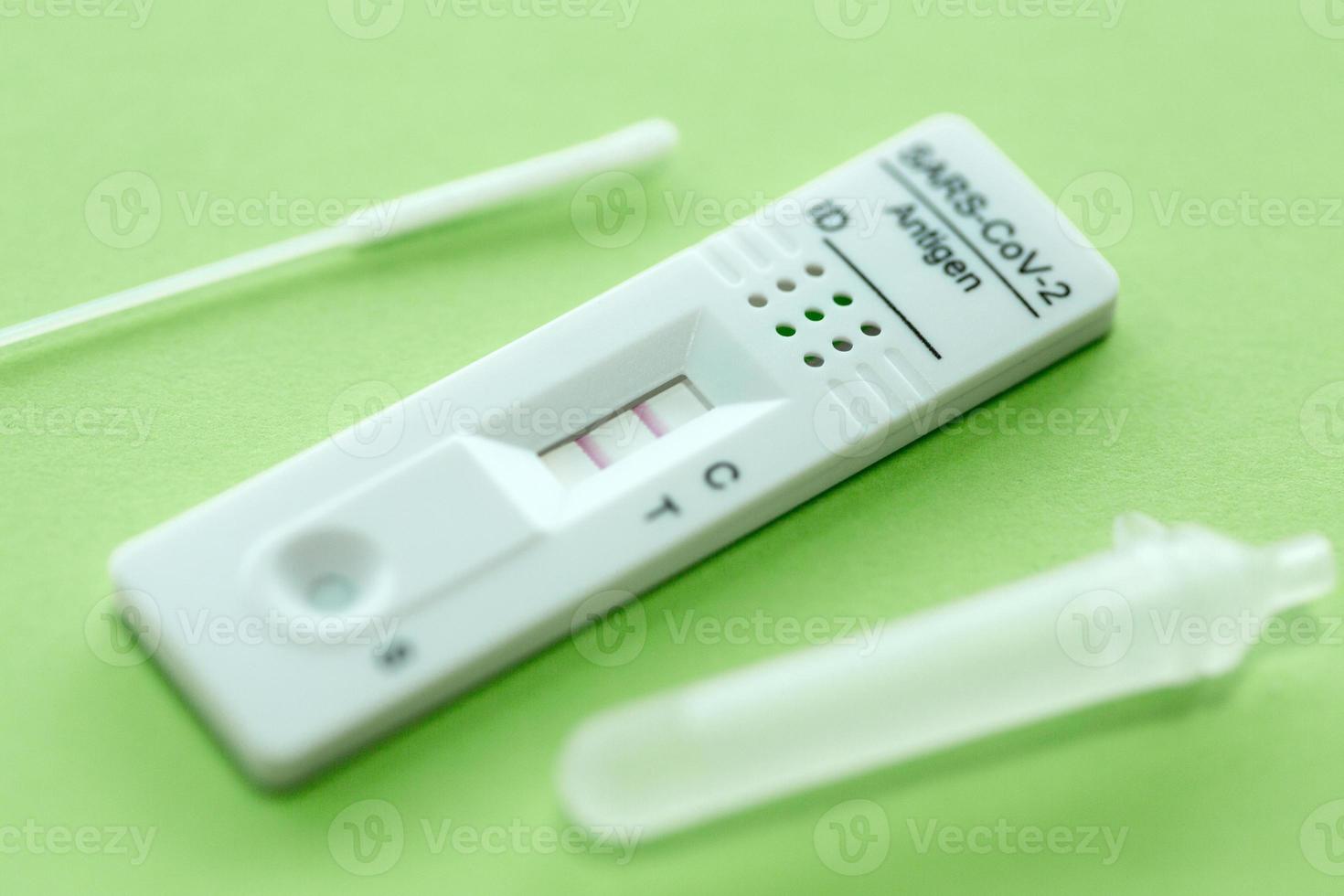 Positive test result by using rapid test device for COVID-19. photo