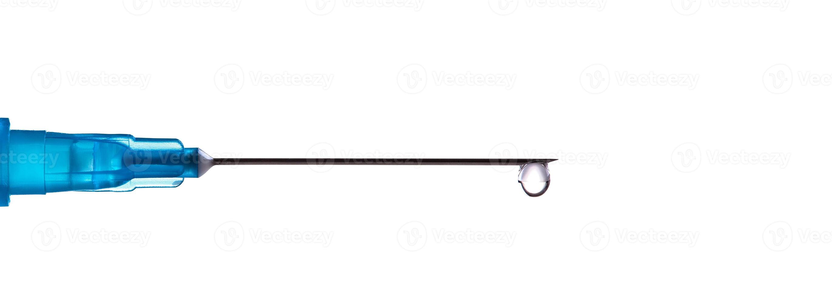 Medical syringe with a needle and vaccine against corona virus. photo