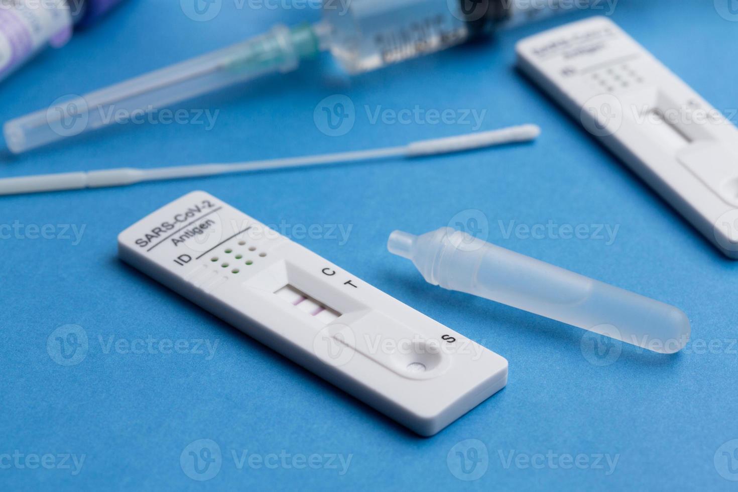 Positive test result by using rapid test device for COVID-19. photo